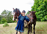 Romanian girl next to horses