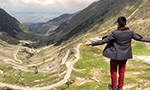 Tourist enjoying a panoramic view of Transfagarasan road